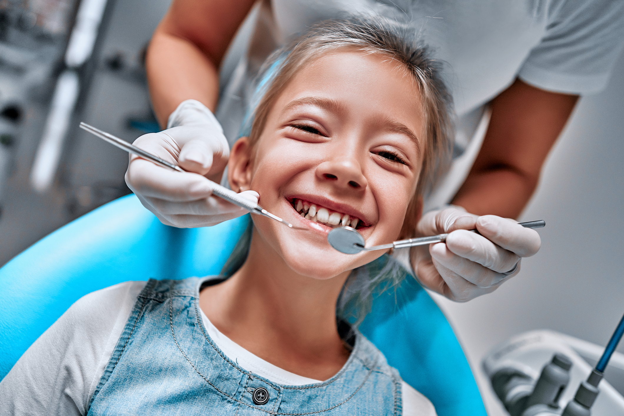 Child being examined by the dentist