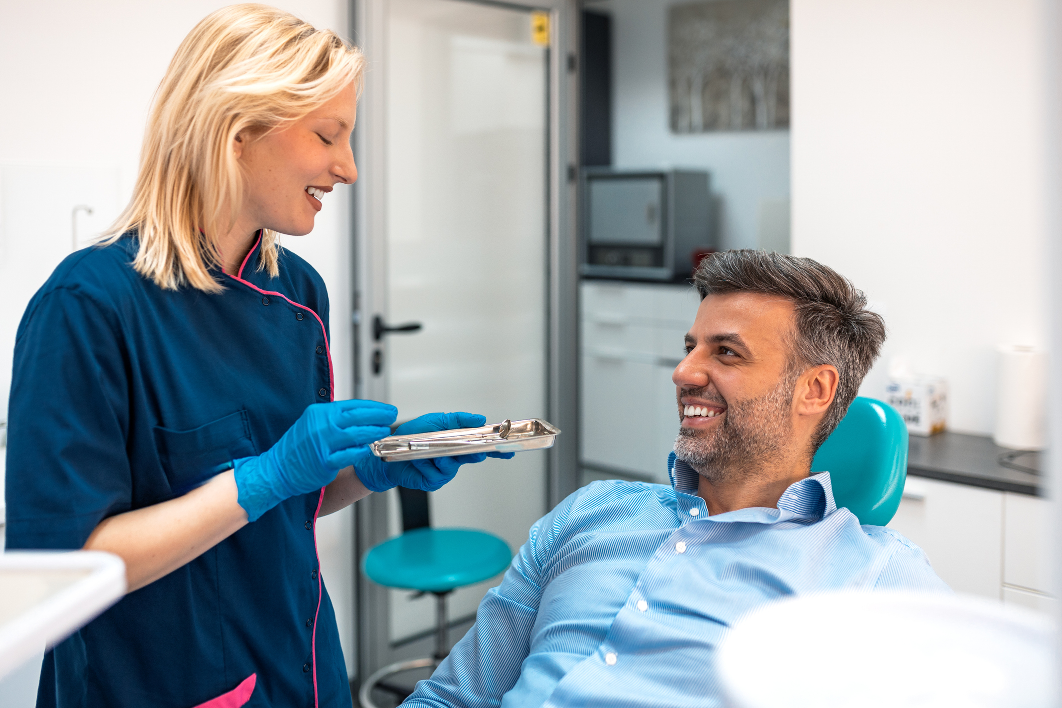 Male sitting in the dental chair discussing options for procedures