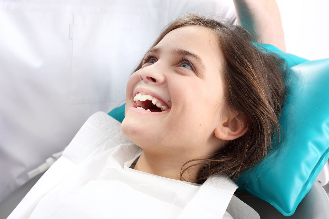 Child visiting the dentist for a no-drill cavity