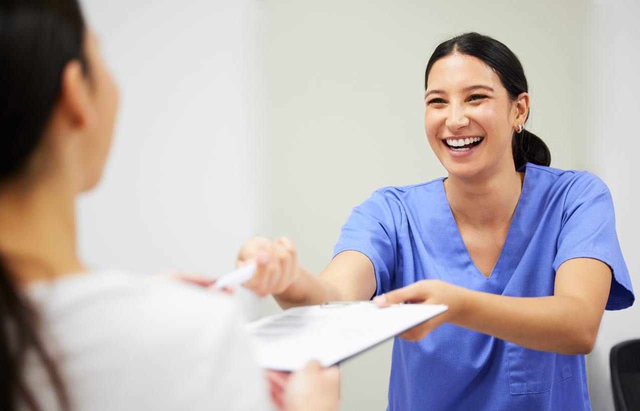 Dentist discussing billing information for dental procedures