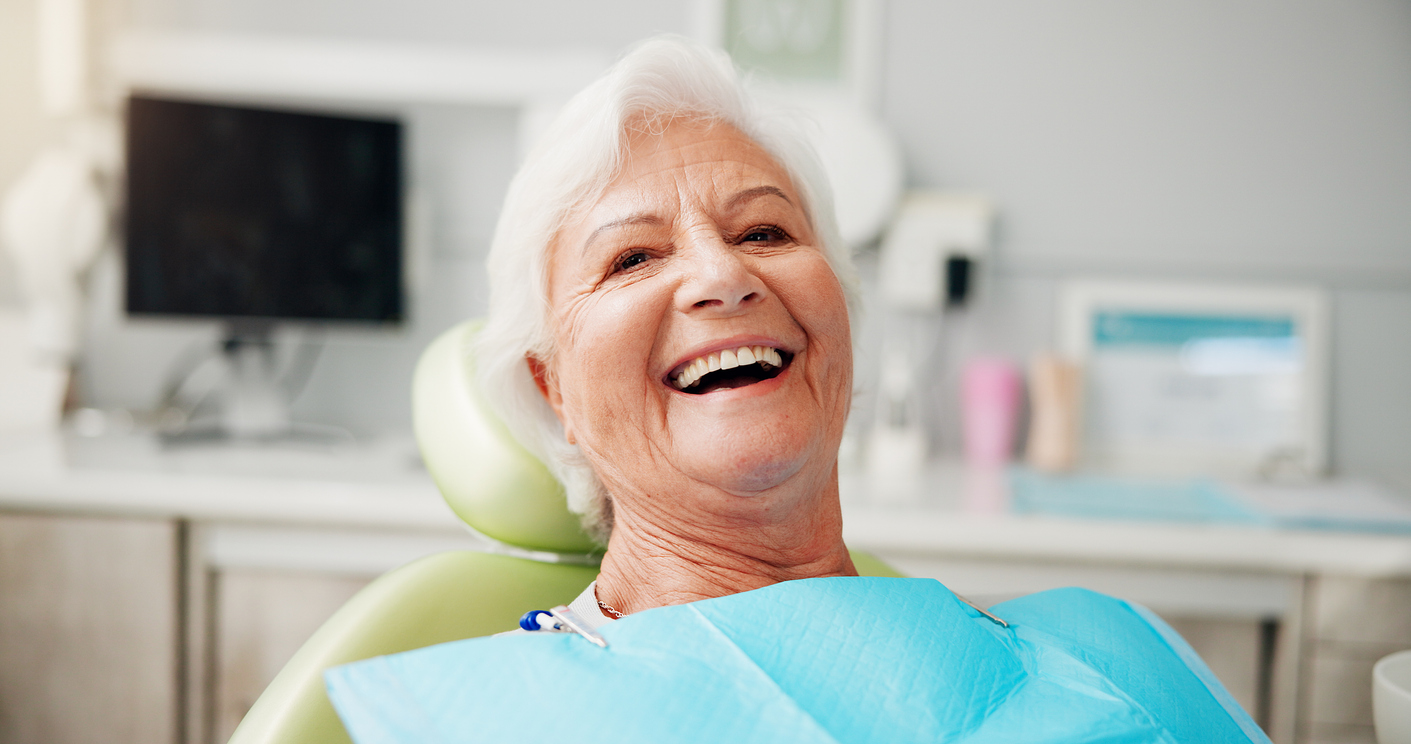 Dental patient that is smiling in the dental chair