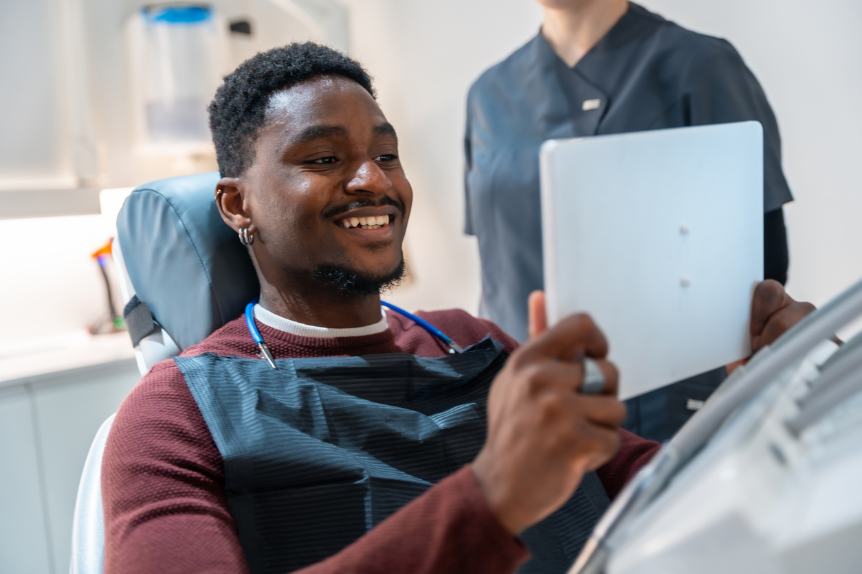 Happy dental patient after saving money with dental pre-estimates